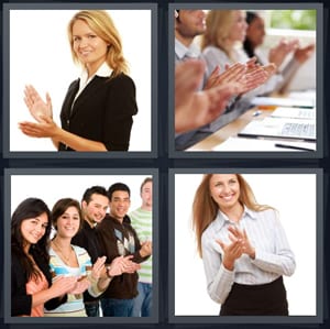 businesswoman in suit hands together, group providing plaudits for speaker, group clapping together, blond woman celebrating