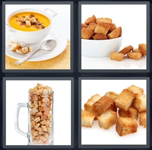 bowl of yellow soup, dried bread in bowl, pitcher full of dried bread, crunchy pieces of bread for salad