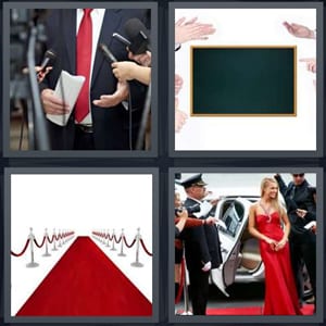 man speaking into microphones, blank chalkboard, red carpet with barriers, celebrity on red carpet