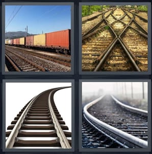 train with large box cars, train tracks criss crossing, rails for train, bars on train track