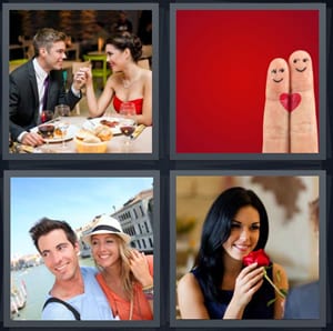 couple on fancy dinner date, fingers in love with heart, couple on vacation, woman smelling red rose from man