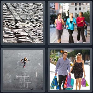 drain on cobblestone street, women walking on street, girl playing hopscotch, couple out shopping