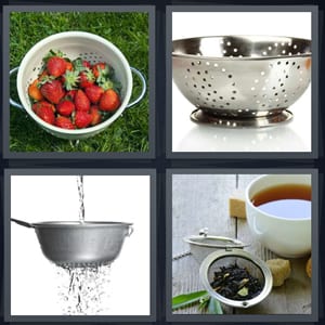 strawberries washed on grass, metal colander with holes, water dripping through pot, tea ball with mug