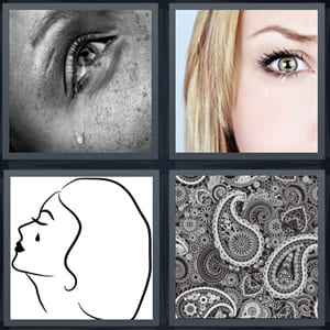 crying woman, woman eye close up, profile of woman crying, paisley fabric pattern