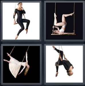 woman in black leotard, gymnast in white on swing, arial dancer, woman leaning back on swing