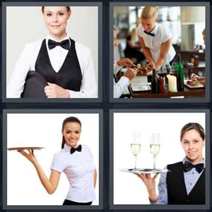 female butler wearing suit, couple having dinner at restaurant, server with tray, server with two glasses of champagne